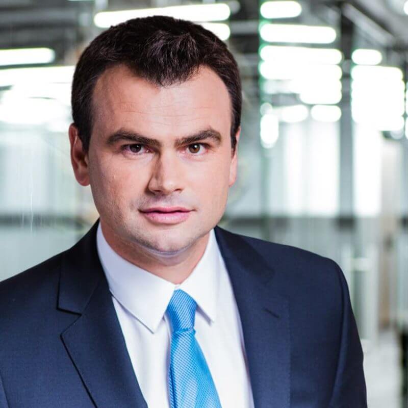 portrait of an executive in a bright blue tie