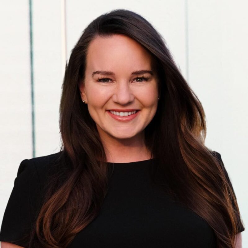 portrait of a woman with long dark hair in a black dress